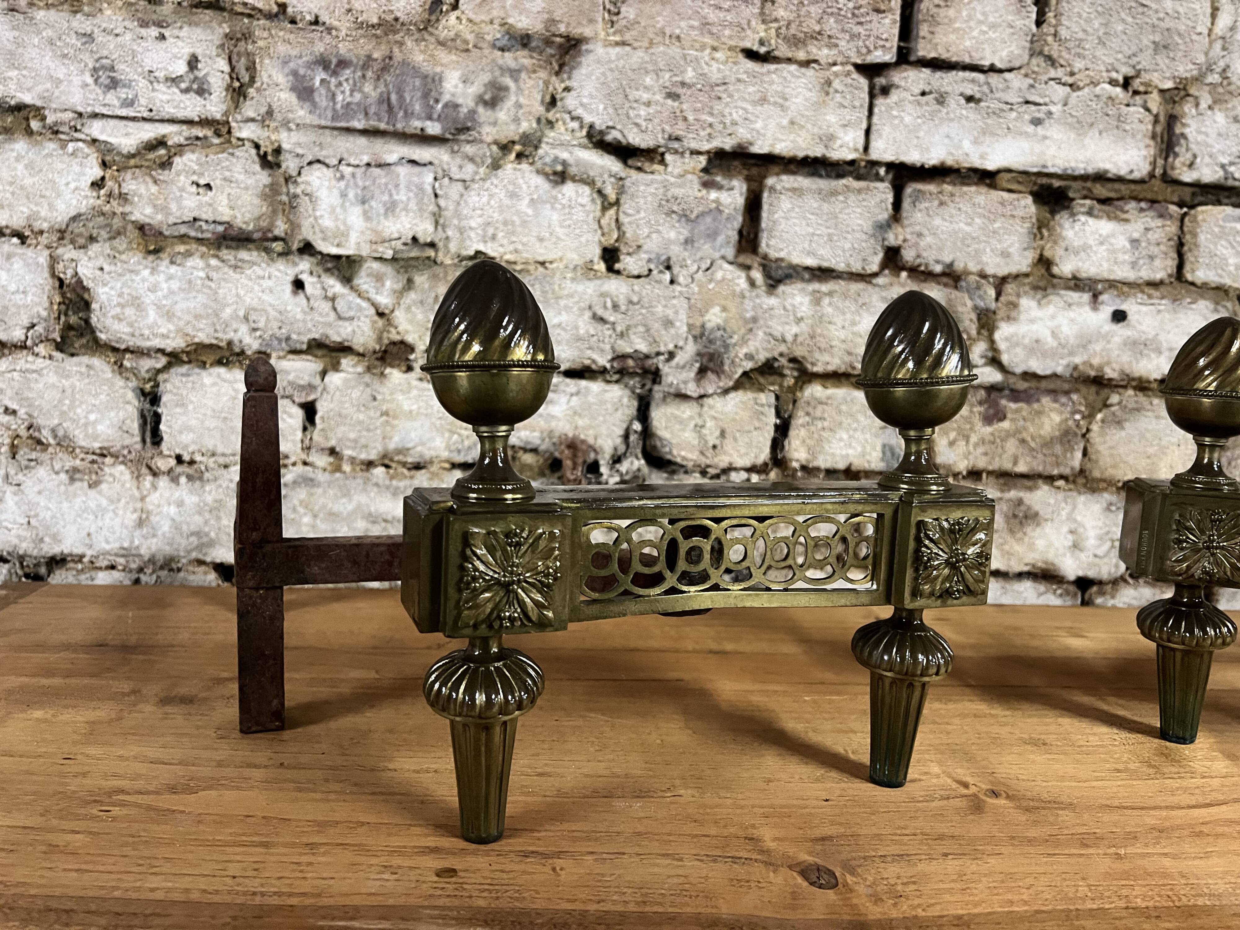 Pair of bronze andirons stamped bouhon frères in louis xvi style