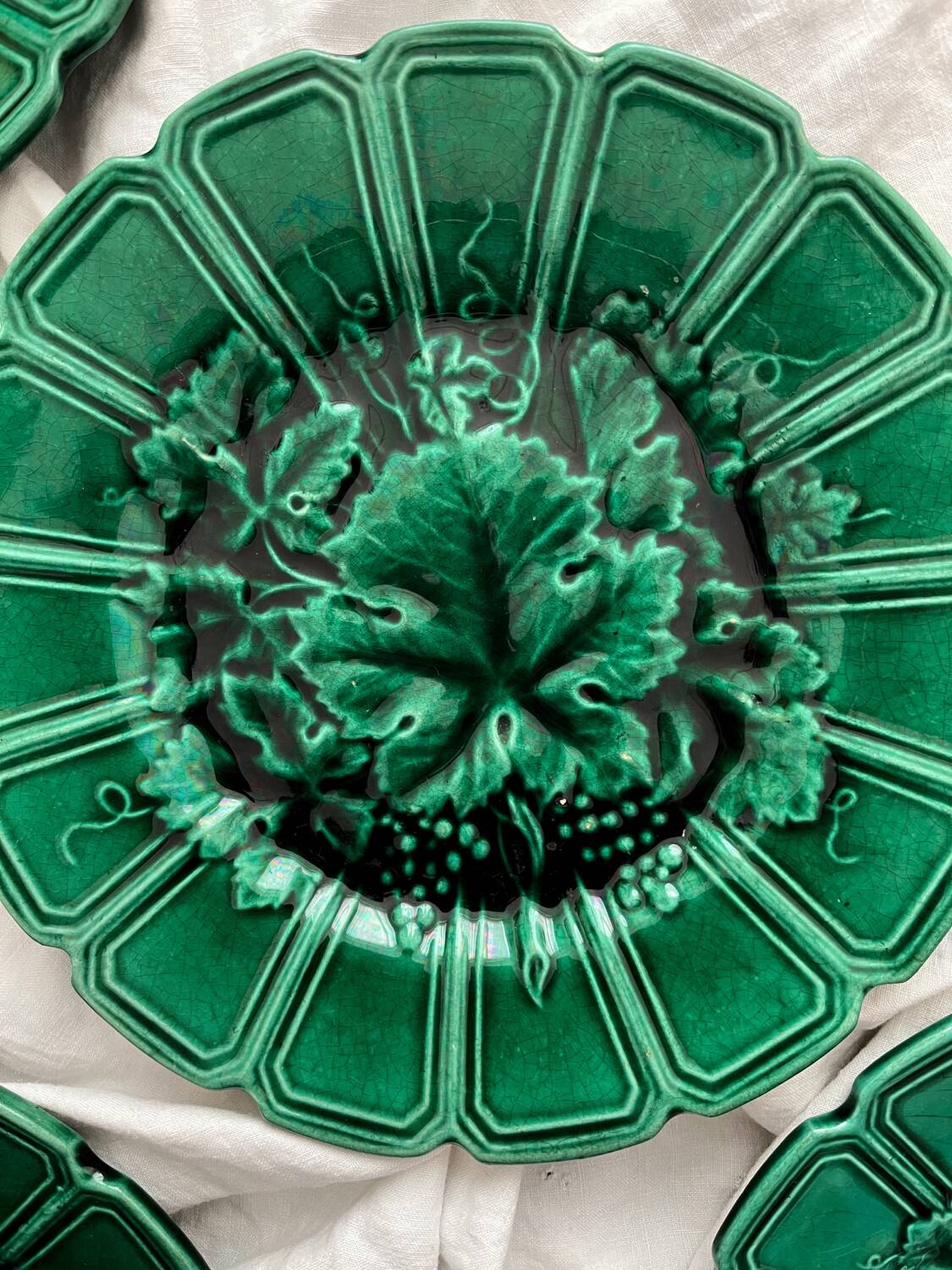 4 old plates in Sarreguemines vine leaf slip