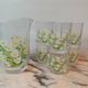 Orangeade service with a jug and six glasses featuring a daisy pattern.