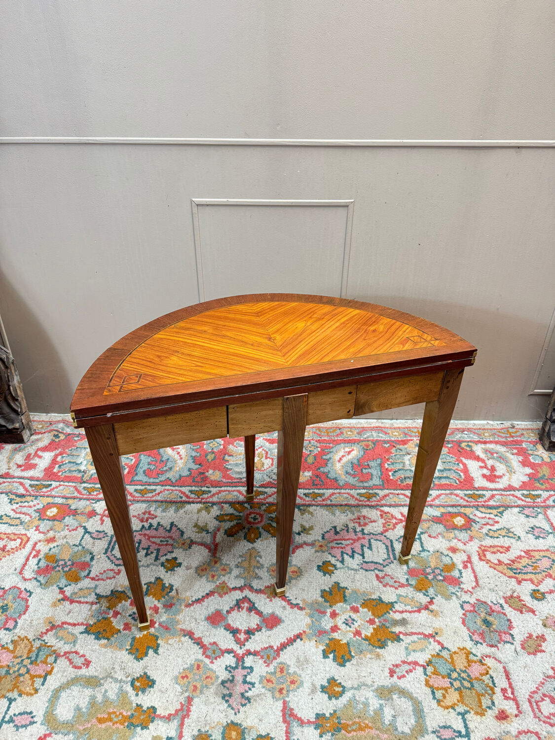 Half-moon game table in marquetry from the Louis XVI period, 18th century.