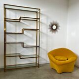 Old shelf in golden metal brass geometric library design 80s vintage