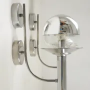 Pair of European mid-century chrome wall sconces with mirrored globe shades