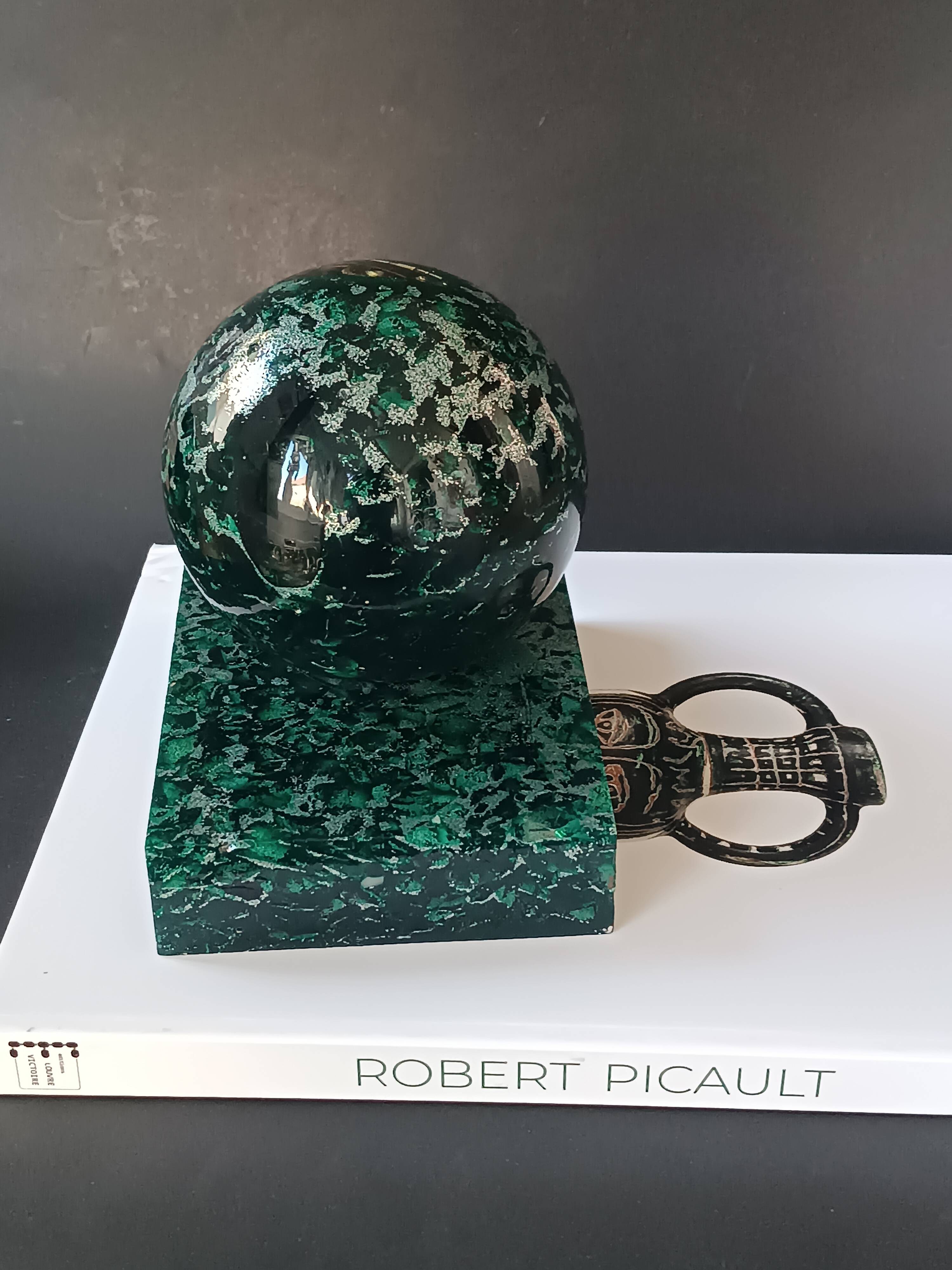 Design bookends in fractal resin with watchmaking inclusions.