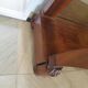 Empire/Restoration style console table with scrolled ends, mirrored back, and claw feet.