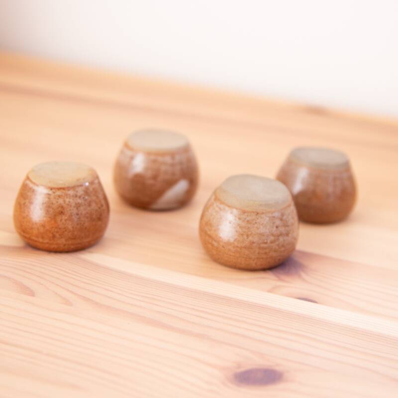 4 brown stoneware candle holders