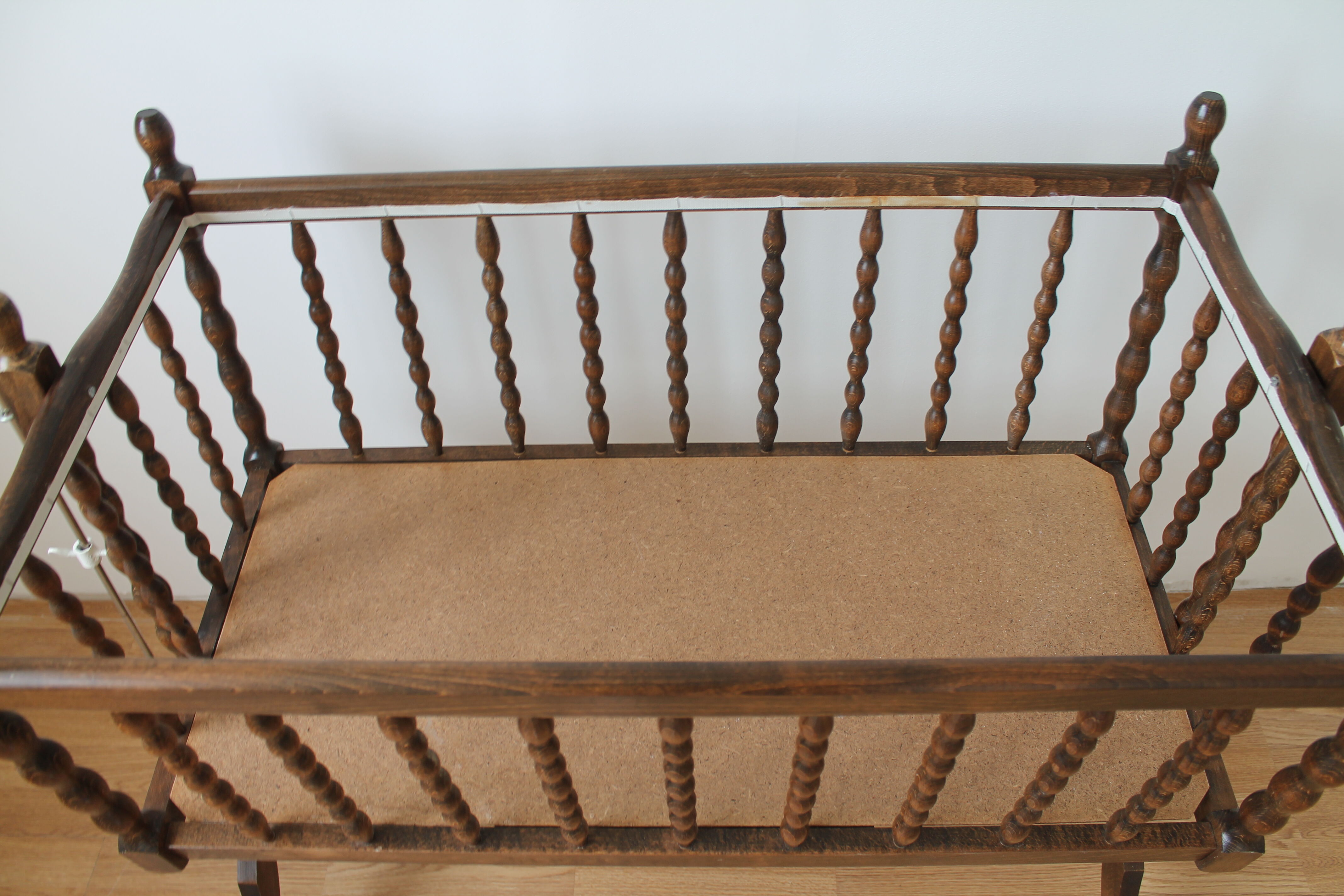 Old Vintage cradle with balance on wheels