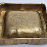 Empty pocket brutalist-inspired ashtray in gilded bronze