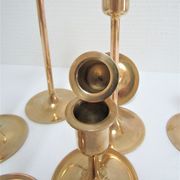 Series of seven candle holders solid brass