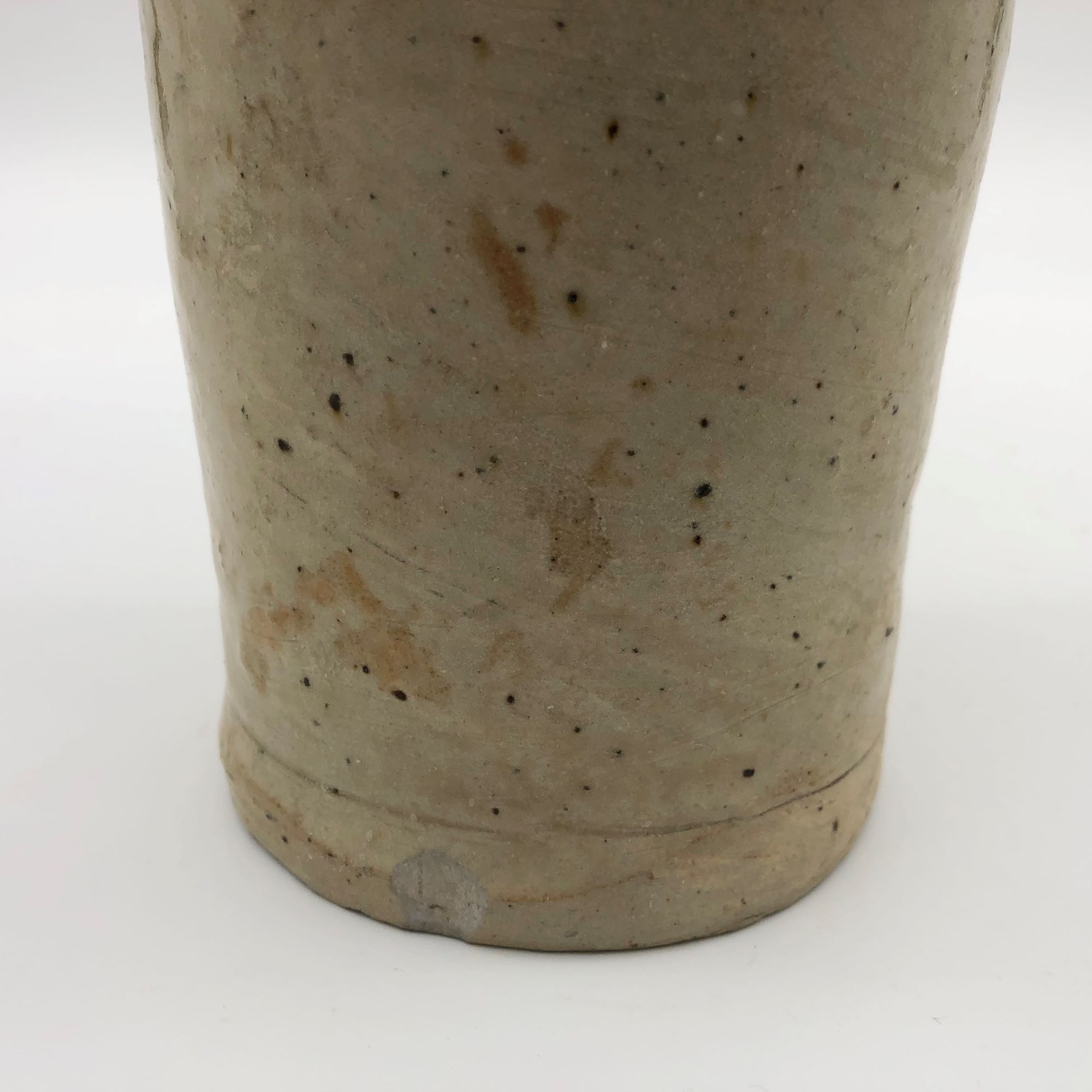 Old hot water bottle in glazed stoneware, beige color
