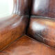 Vintage dark brown sheep leather wingback armchair