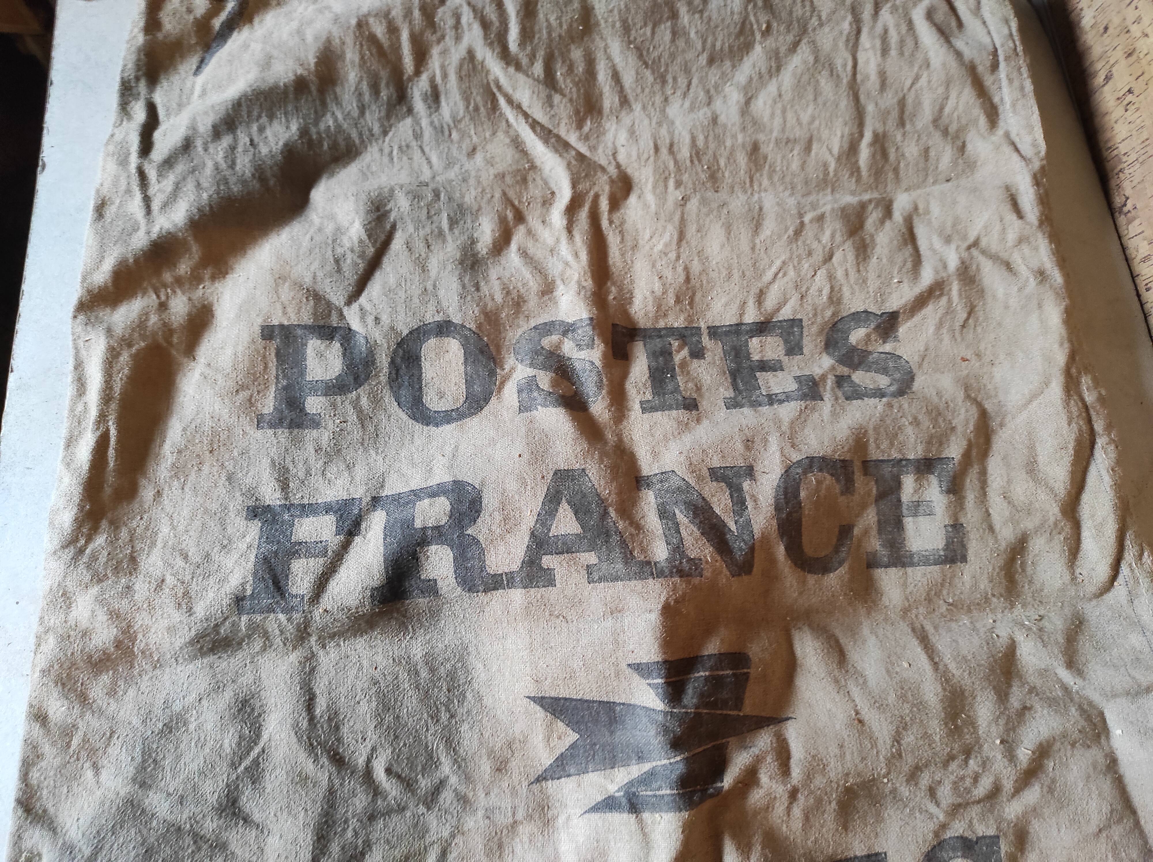 Vintage postal bag trade object of La Poste in mixed-race canvas burlap