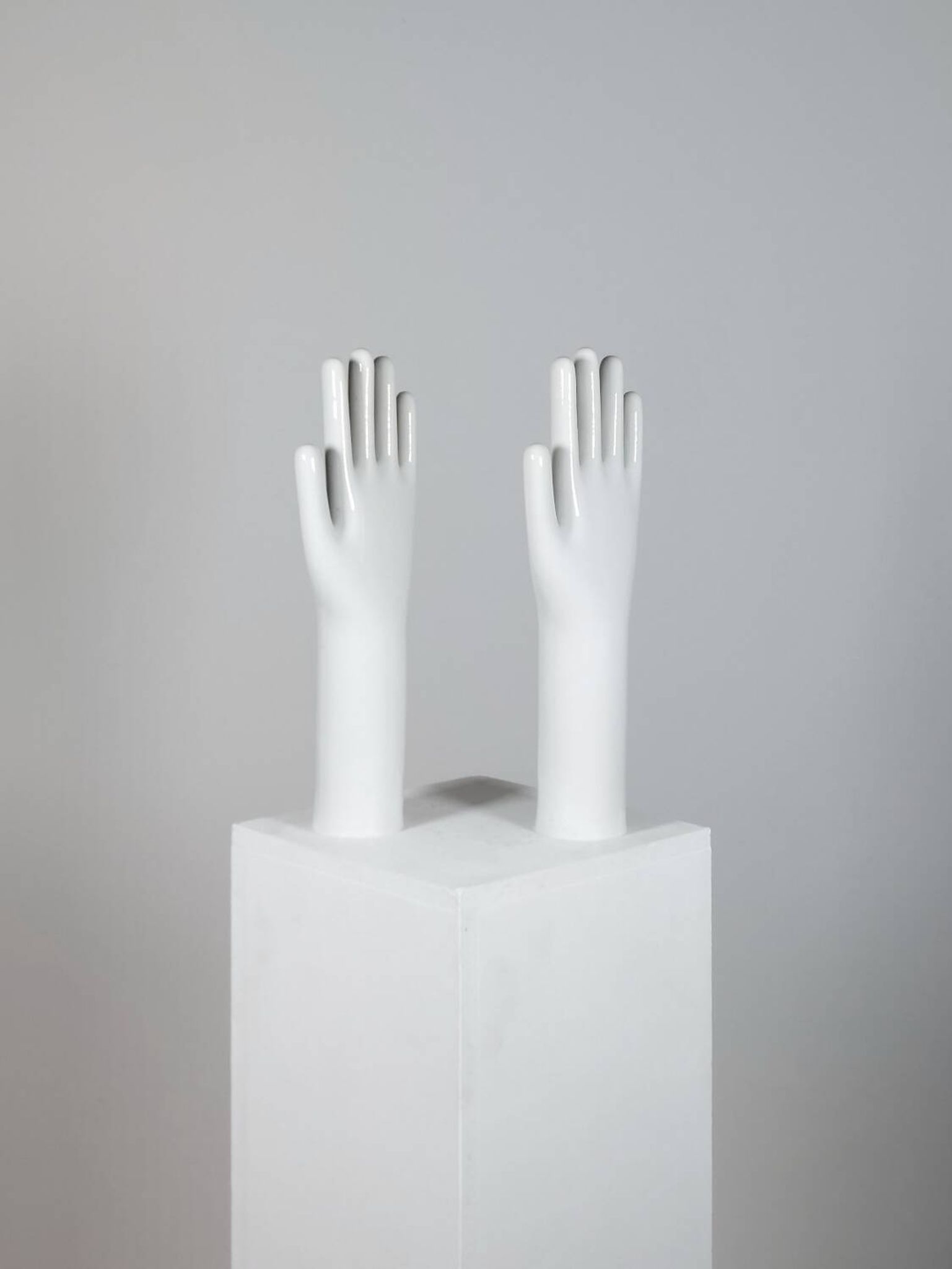 Pair of authentic vintage jewellery displays in industrial porcelain representing hands.