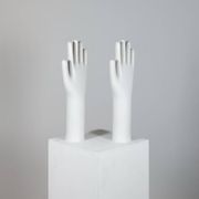 Pair of authentic vintage jewellery displays in industrial porcelain representing hands.