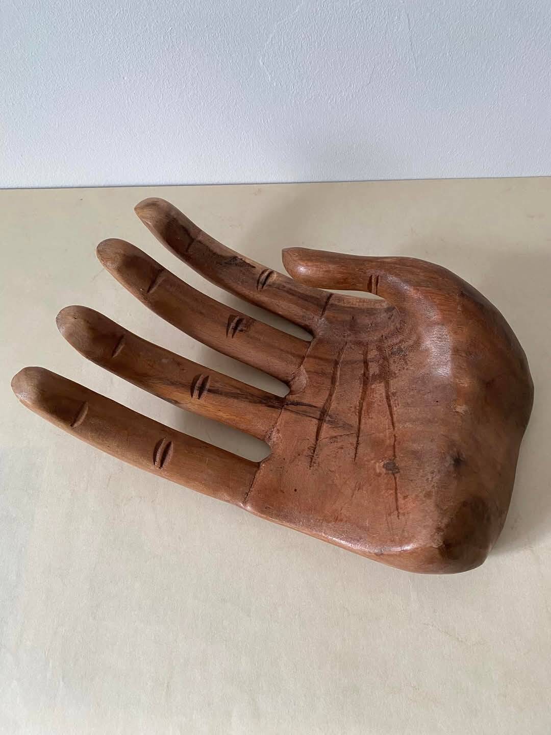 Wooden hand-held pocket emptier