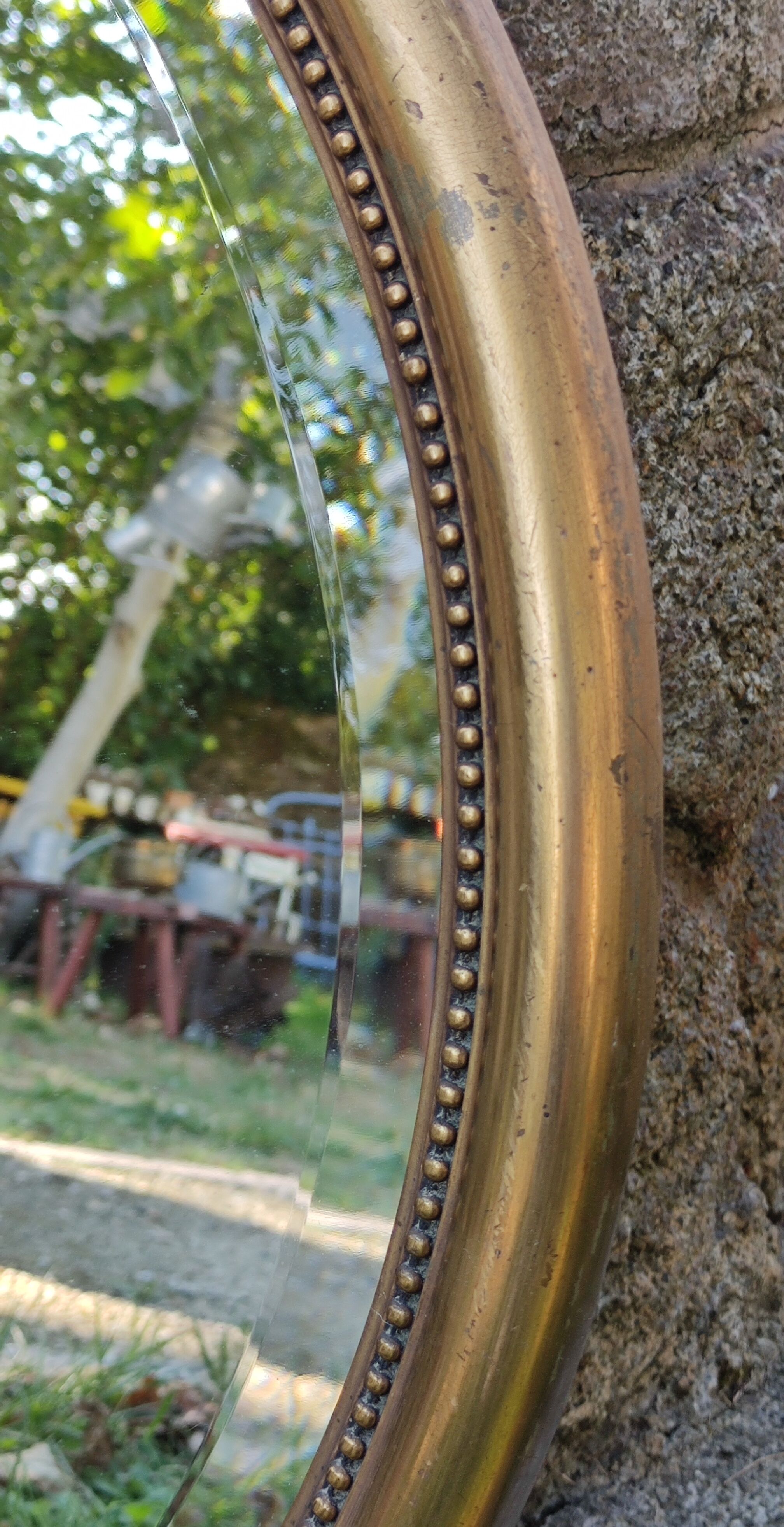 Old beveled round mirror