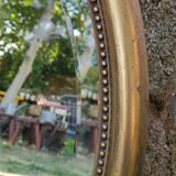 Old beveled round mirror