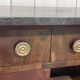 Empire buffet from the early 19th century in mahogany with a black marble top.