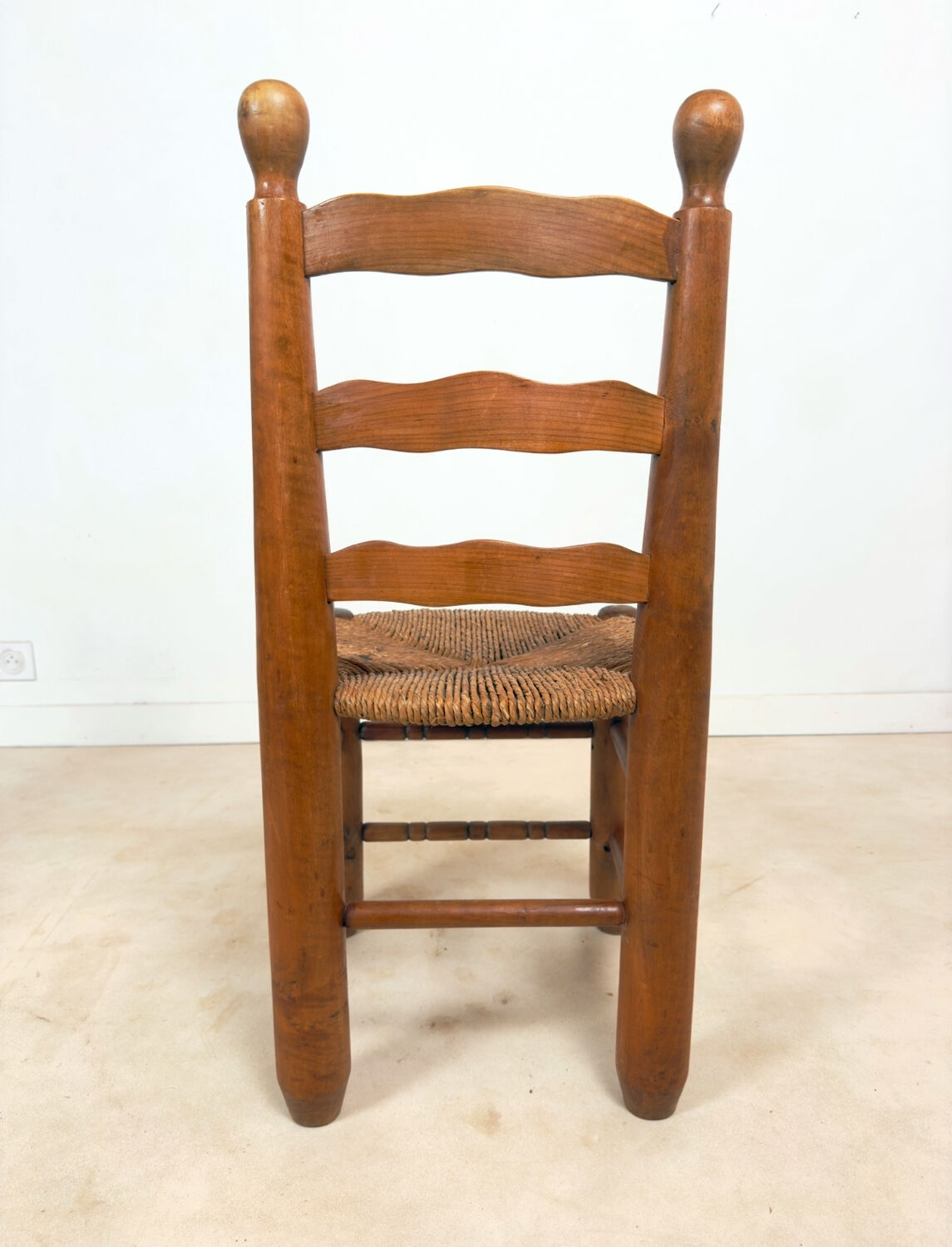 Vintage wooden chair with rush seating