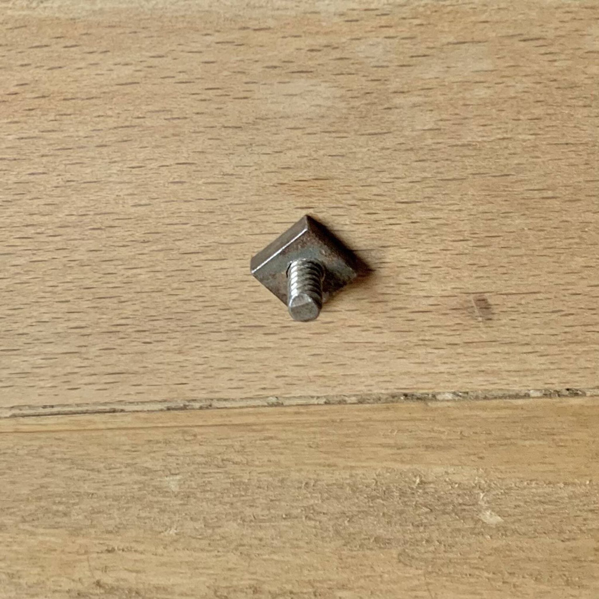Old small hanging shelf in solid wood