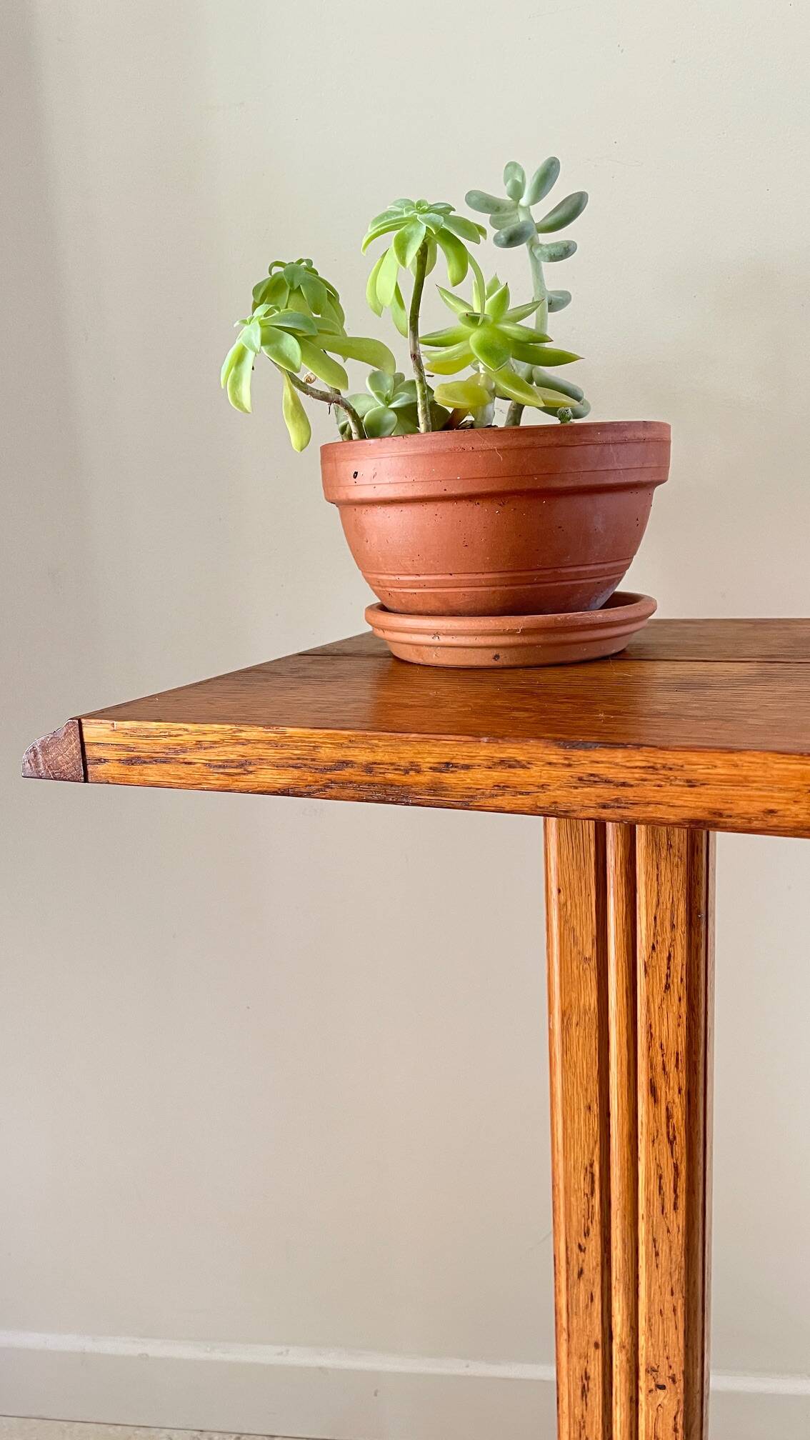 Vintage solid oak saddle plant holder