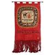 Vintage handwoven tapestry with a folk scene and archaic Slavic writing.
