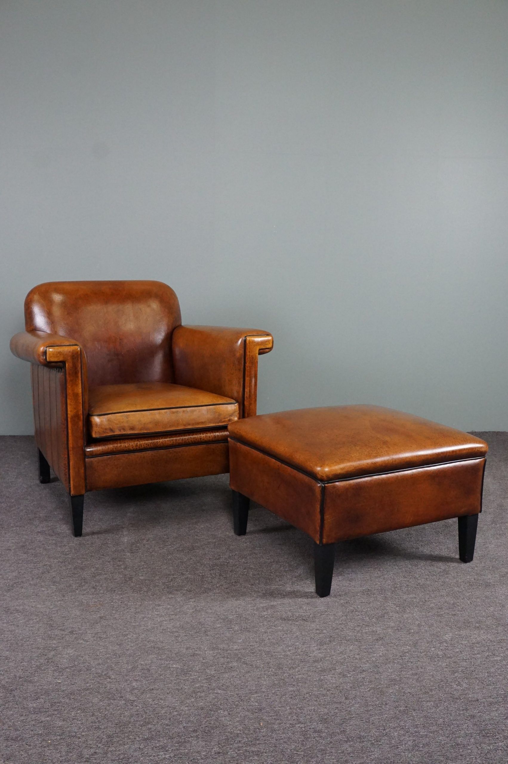 Schapenleren armchair and studio lounge stool