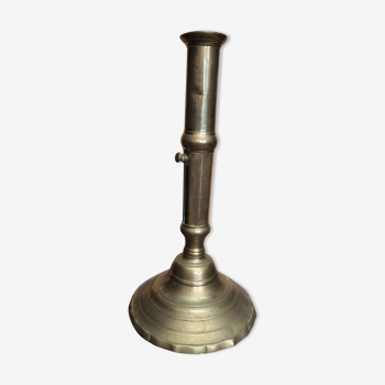 Golden candle holder with old pusher