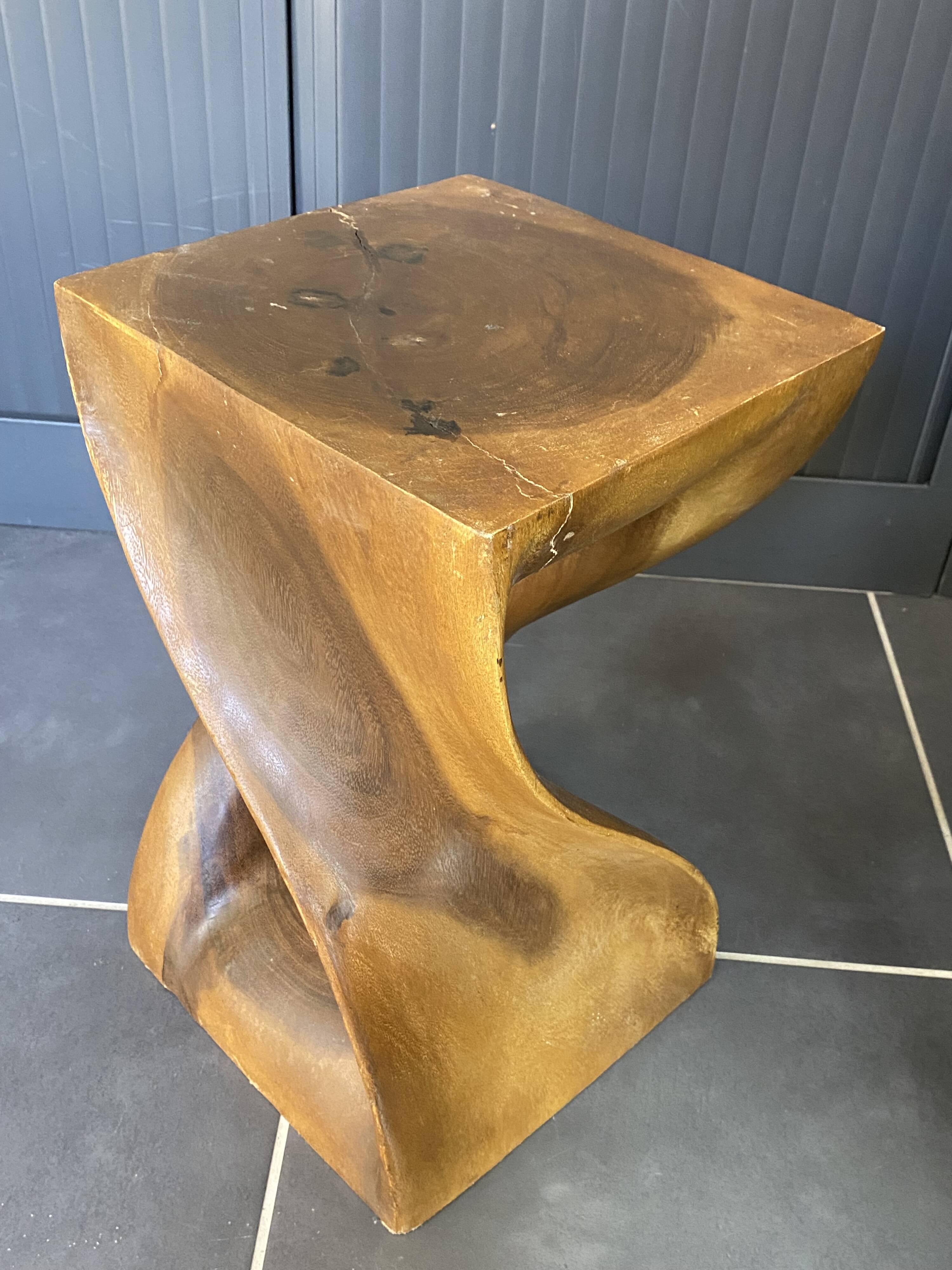Stool n2 in solid raw walnut wood carved from the mass 1970