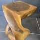 Stool n2 in solid raw walnut wood carved from the mass 1970
