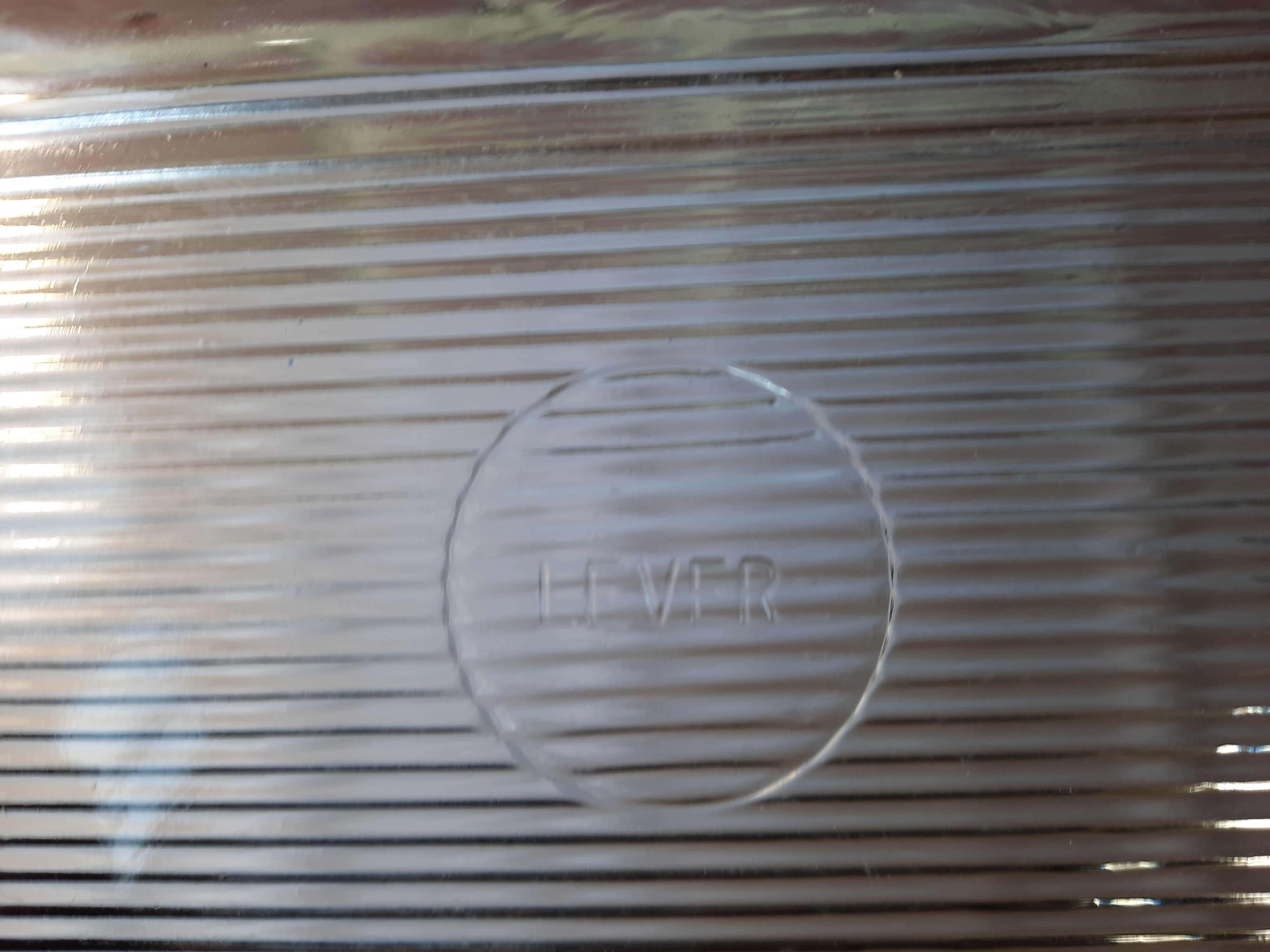 Transparent glass butter dish from lever
