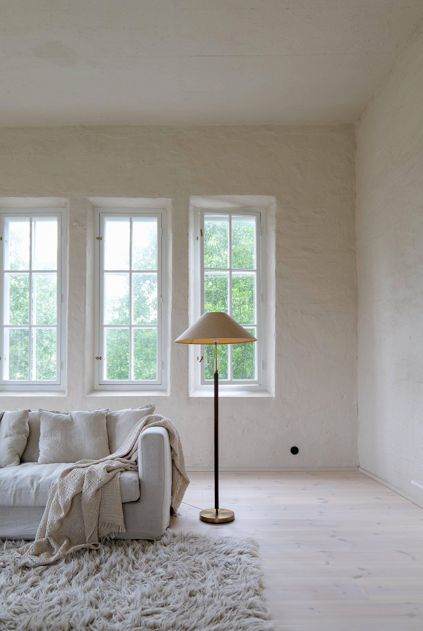 Mid-century brown leather and patinated brass floor lamp by Falkenbergs Belysning, Sweden, 1960s.