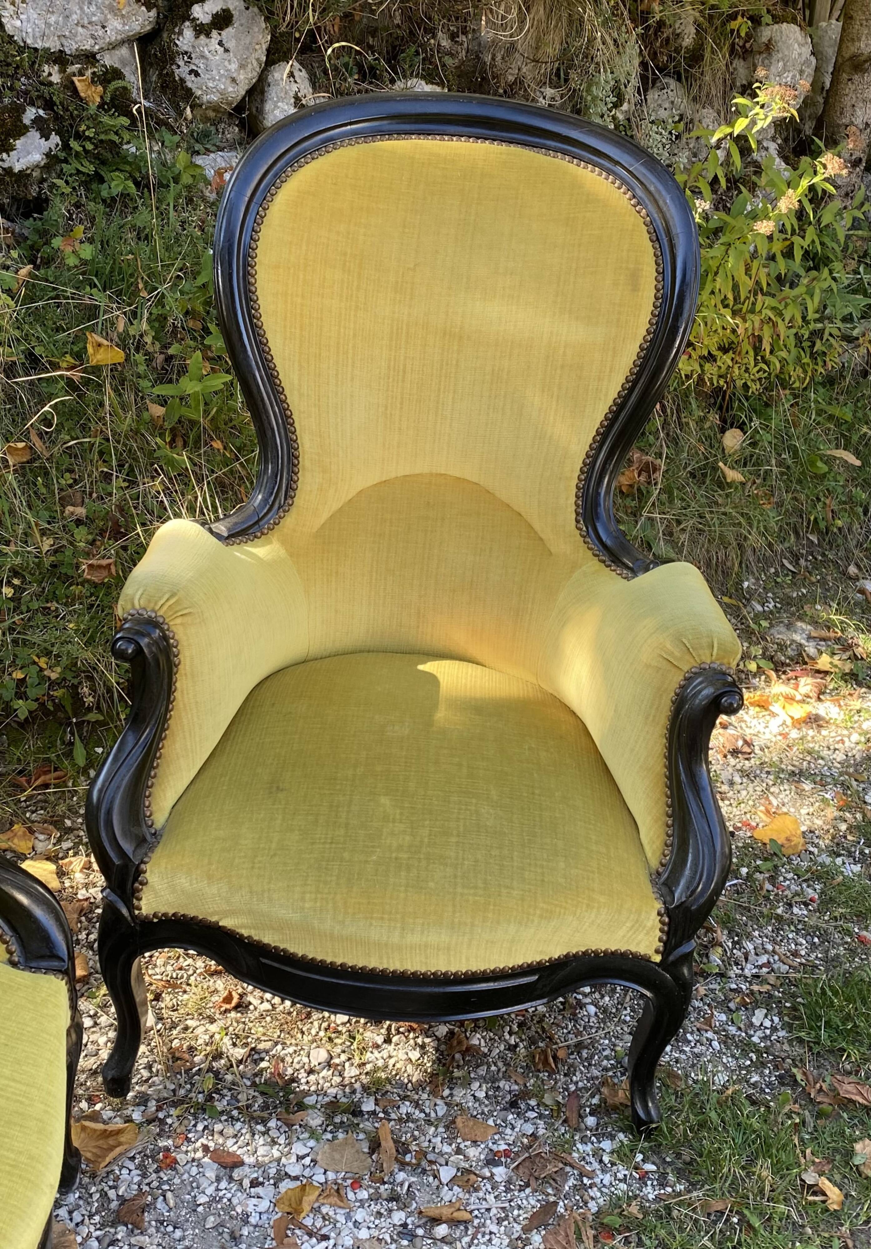 Pair of 19th century armchairs in black lacquered wood