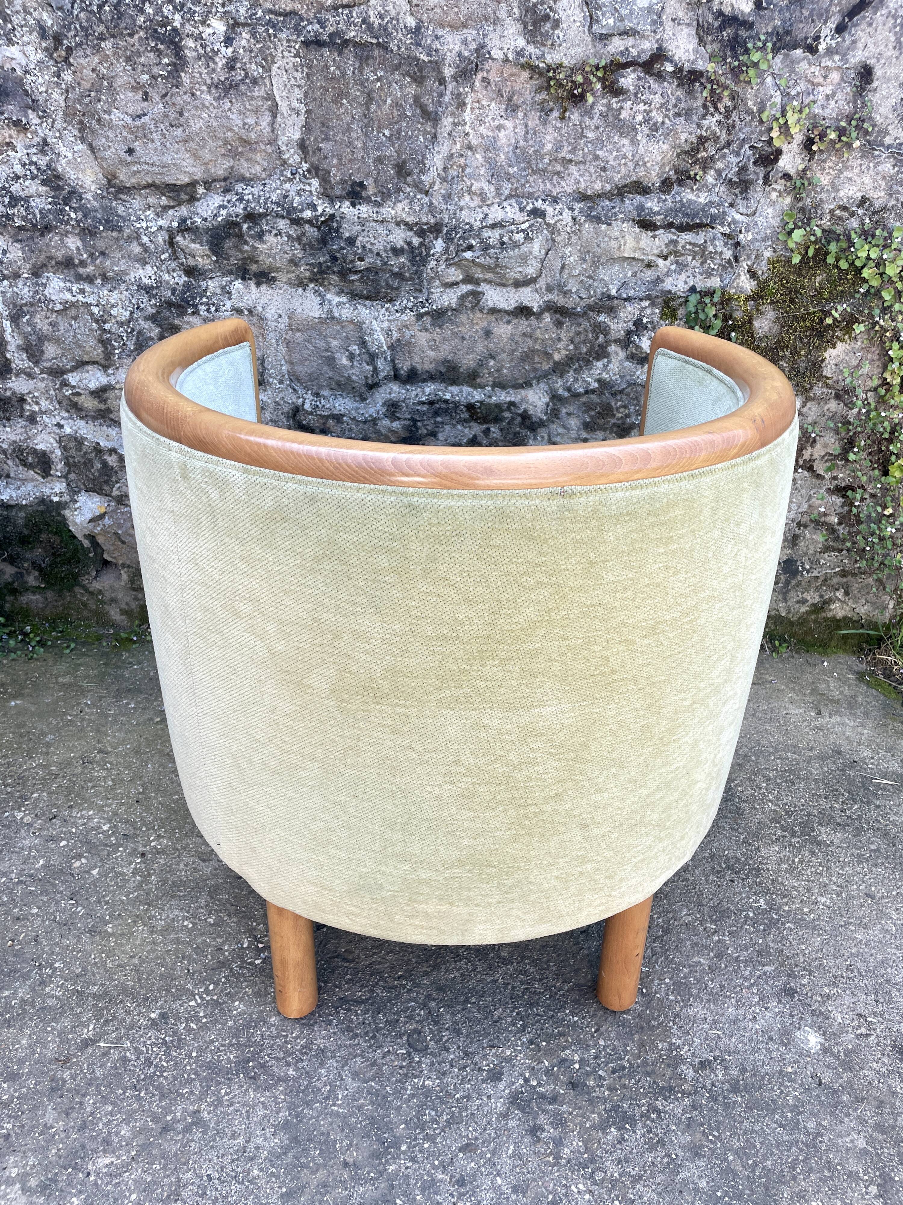 Pair of barrel-shaped armchairs in beech and almond green velvet by Maison Rosello