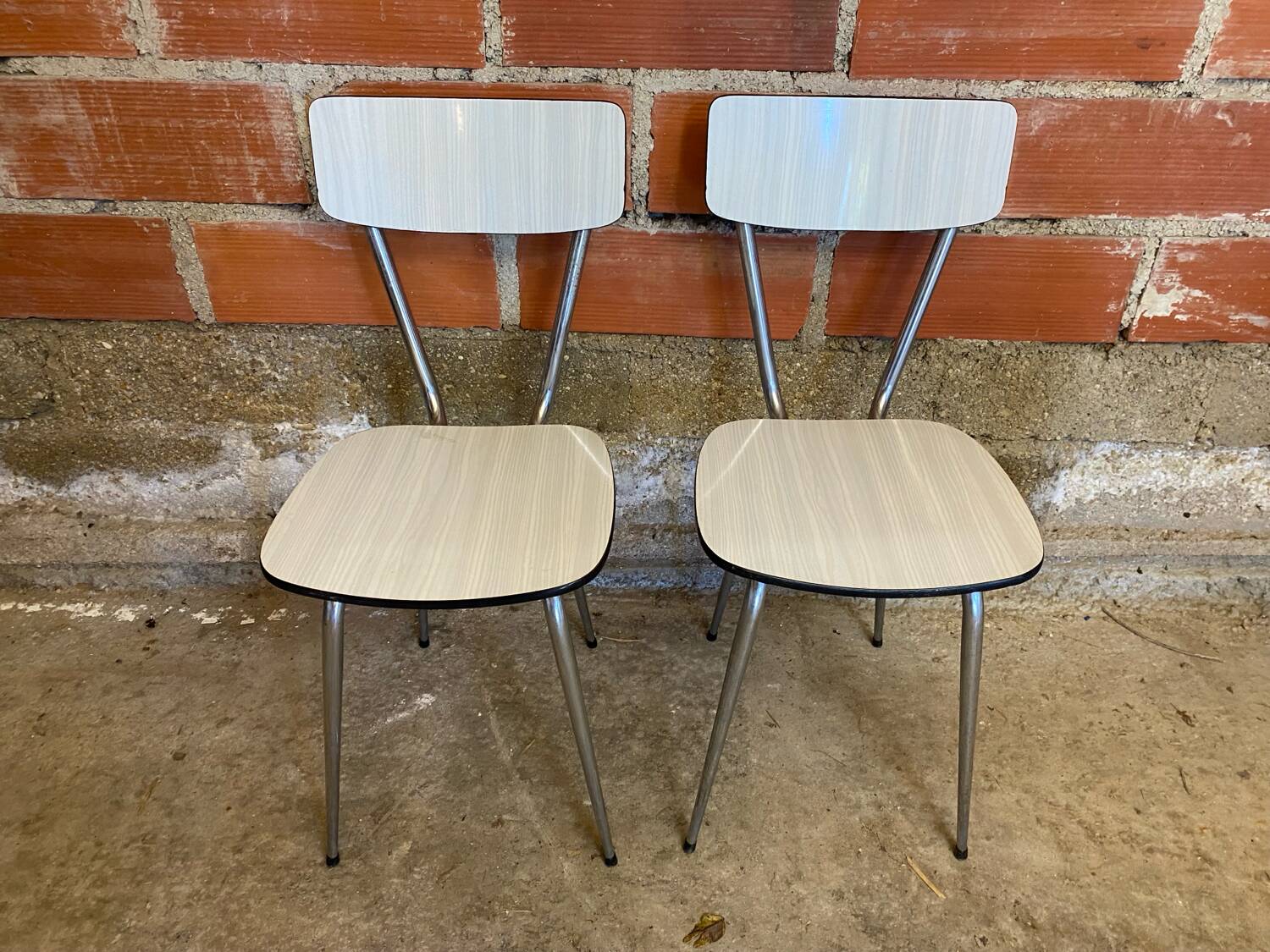 Pair of antique chrome metal chairs + white formica seat & back