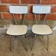 Pair of antique chrome metal chairs + white formica seat & back