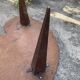 Mid-century coffee table with a palette shape and splayed legs.