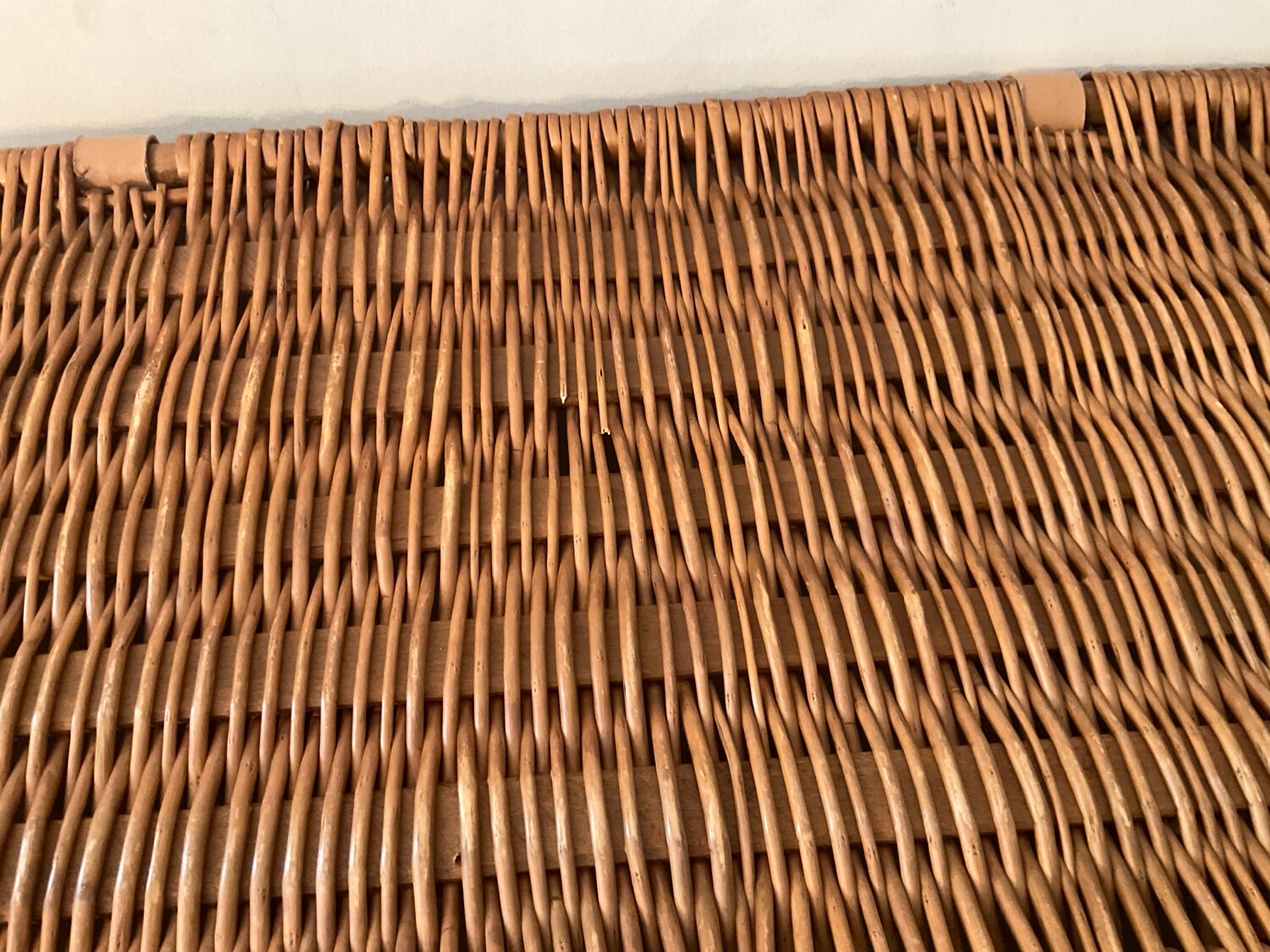 Woven wicker vintage suitcase