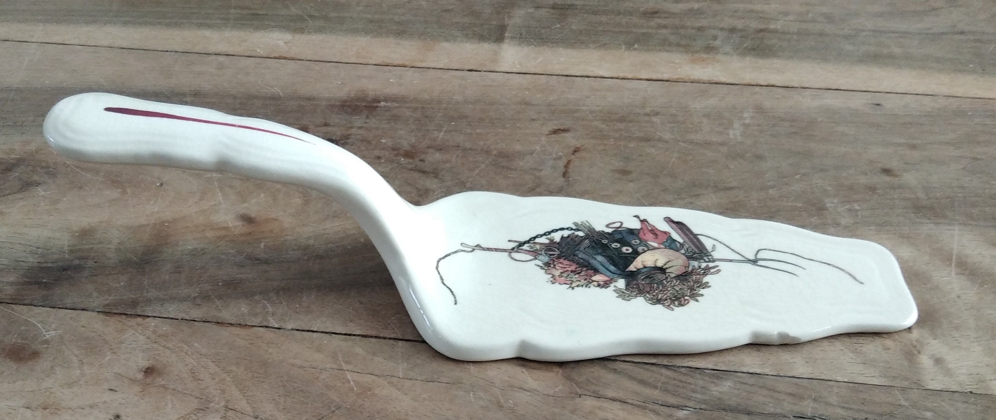 Earthenware pie shovel Obernai décor signed Henri Loux