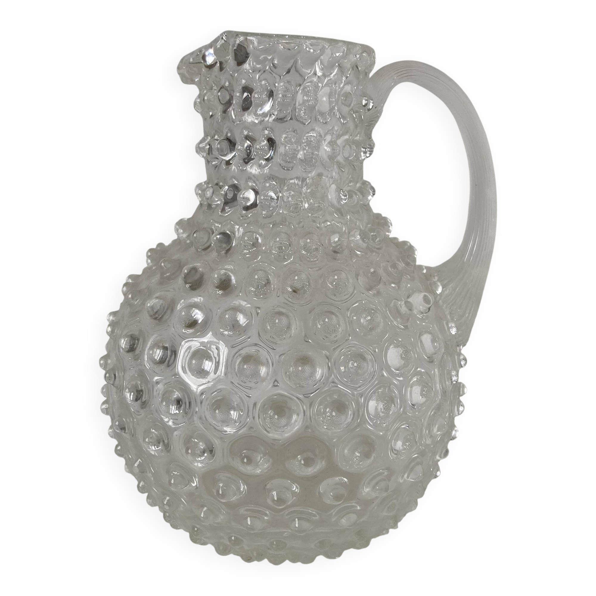 Beautiful and large vintage glass jug with a handle, made of clear hot-worked glass.