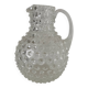 Beautiful and large vintage glass jug with a handle, made of clear hot-worked glass.
