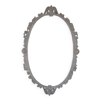 Large oval metal frame medallion