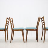 Ensemble de quatre chaises à manger années 1960.