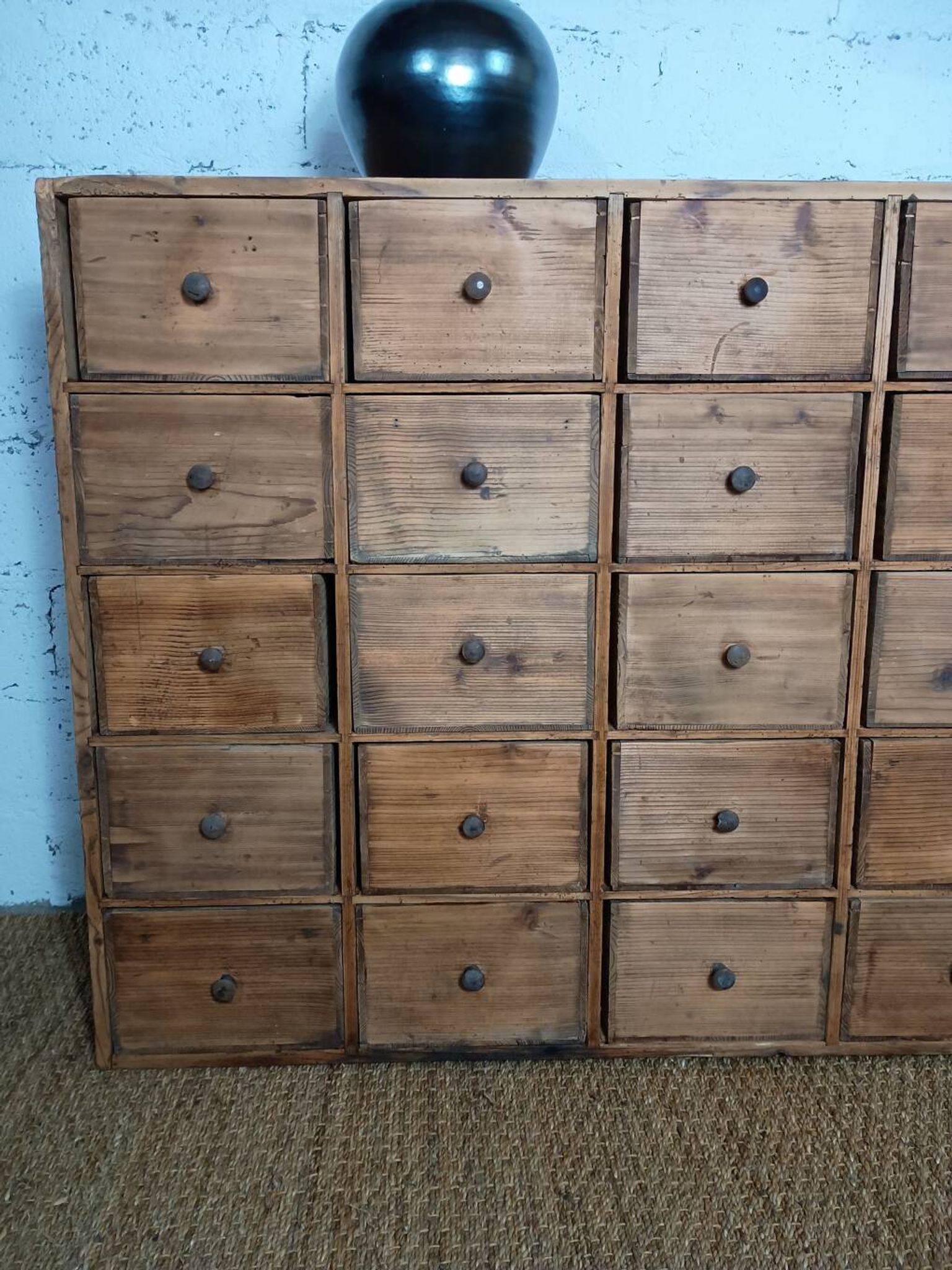 Industrial or apothecary workbench with 30 vintage wooden drawers.