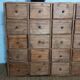 Industrial or apothecary workbench with 30 vintage wooden drawers.