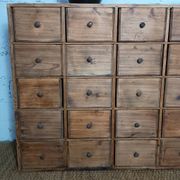 Industrial or apothecary workbench with 30 vintage wooden drawers.