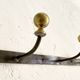 Wall-mounted coat rack with 4 hooks in metal and brass