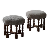 Pair of mid-century Danish oak stools with shearling lambswool upholstery, 1950s.