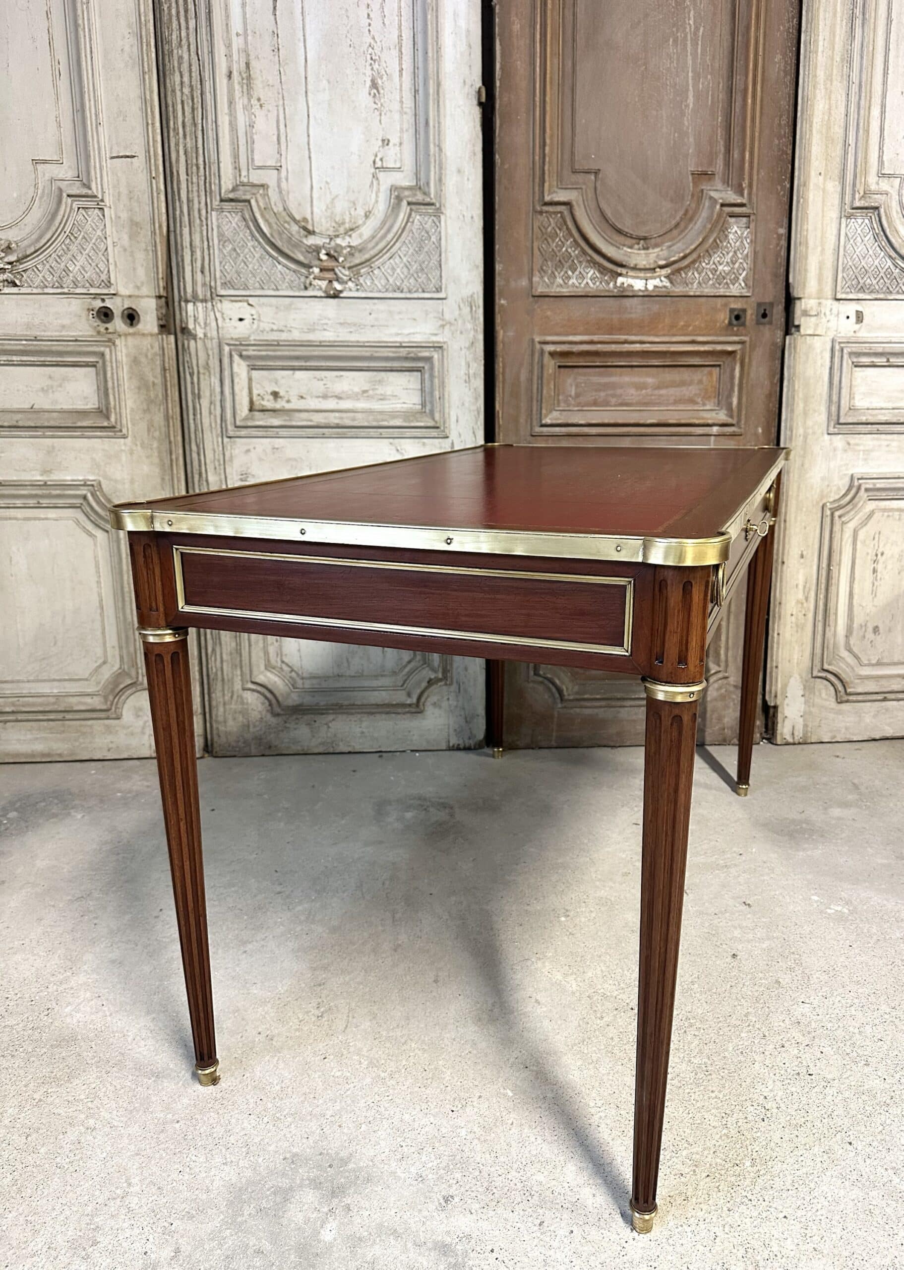 Louis XVI style flat desk in mahogany from around 1950.