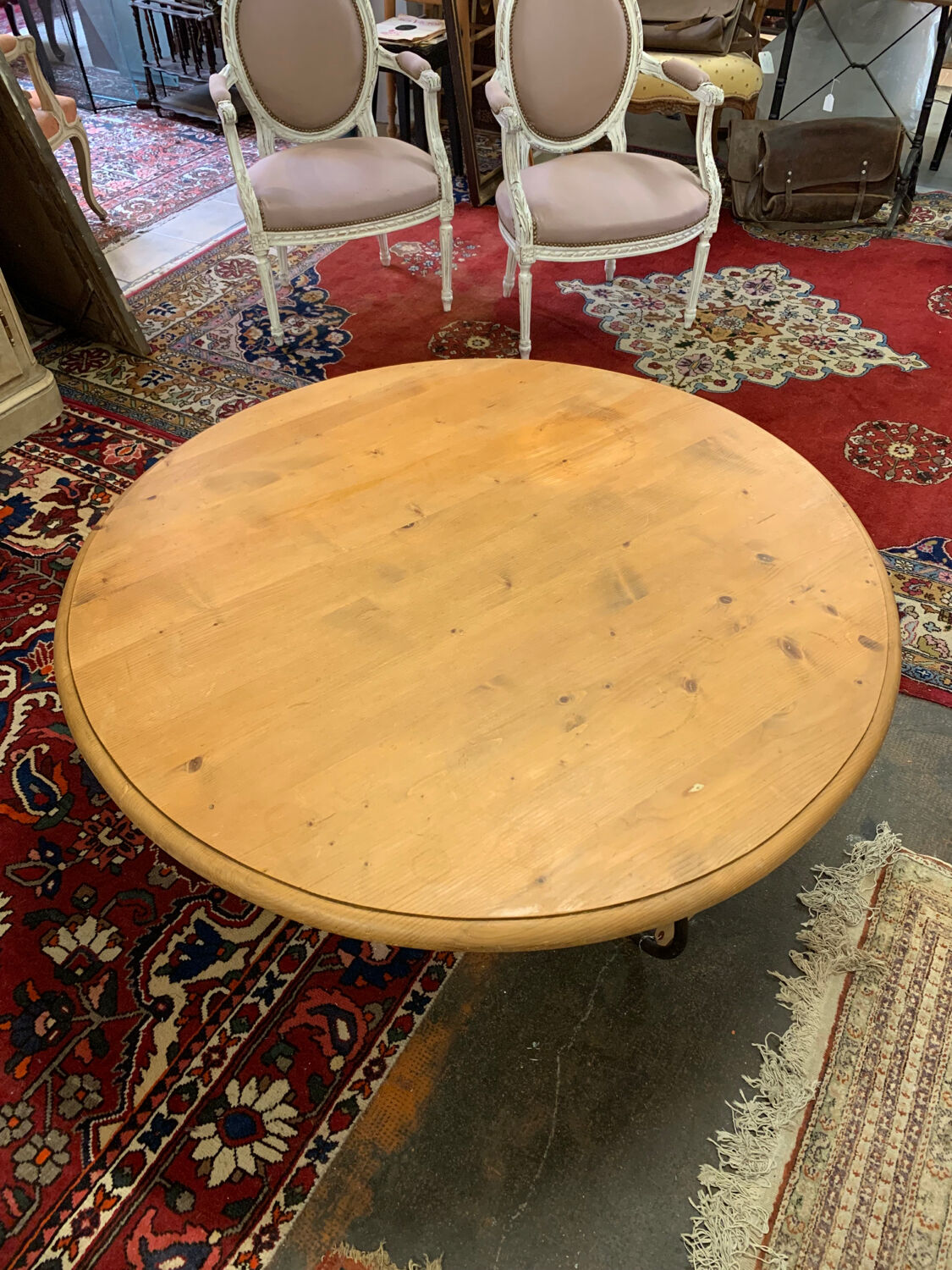 Round wood and wrought iron coffee table