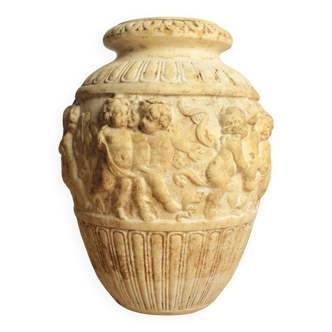 Old plaster vase decor of cherubs antique decorative flower pot